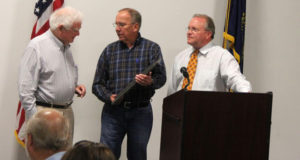Retired Circuit Court Judge Kenneth H. Goff, left, is recognized during the Grayson County Manufacturing Appreciation Luncheon. Goff has been instrumental in bringing industry to Grayson County for nearly six decades and recently stepped down from the Leitchfield-Grayson County Industrial Development Corp. Board of Directors. Board member Darrell Moll and Dudley Cooper, executive director of the industrial development corp., present a plaque. 